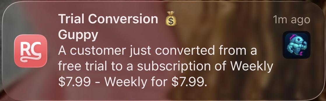 RevenueCat notification showing a Guppy customer converting from trial to a Weekly $7.99 subscription